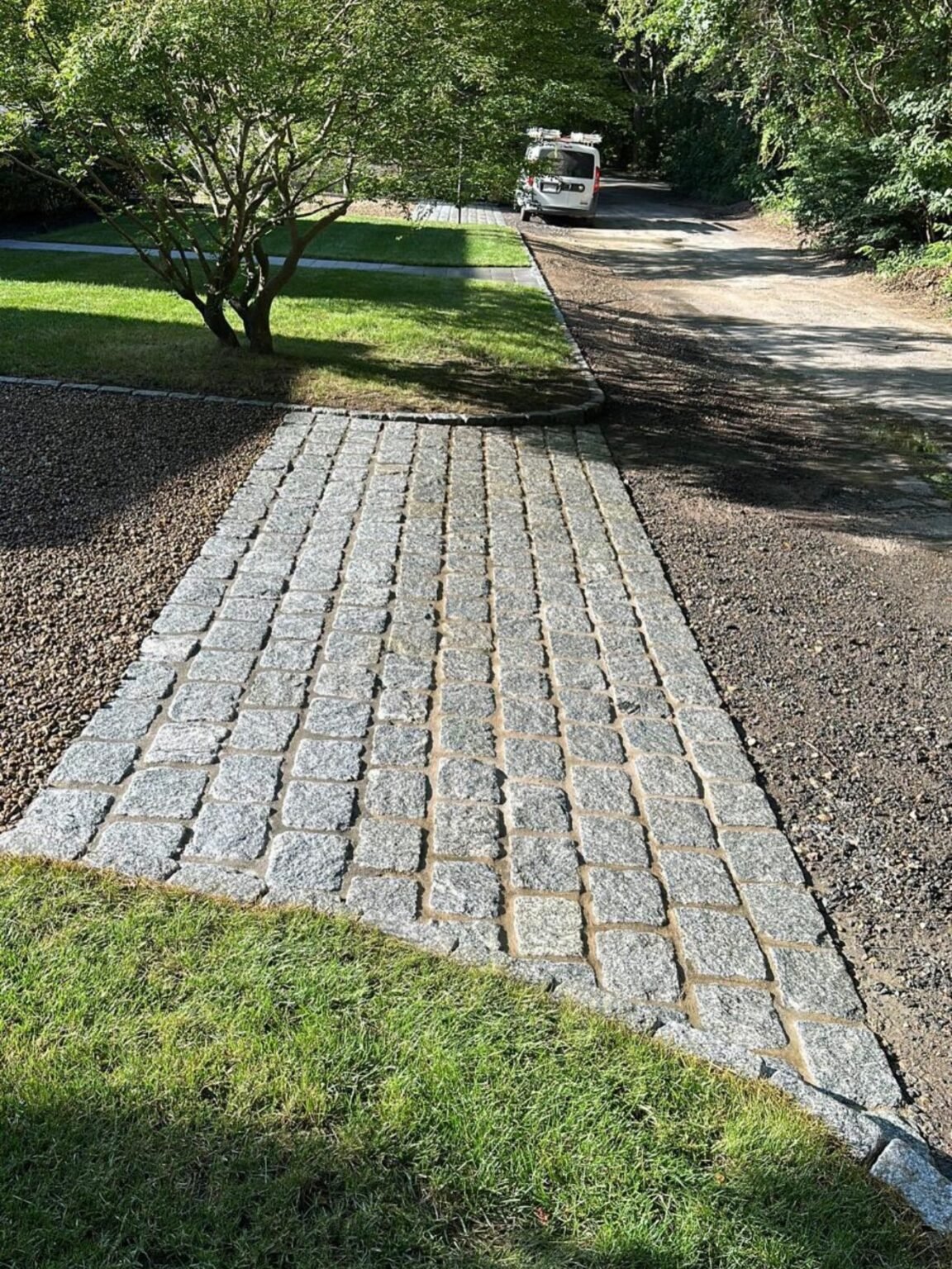 Cobblestone walkway built by Bridi Masonry in Cape Cod, MA