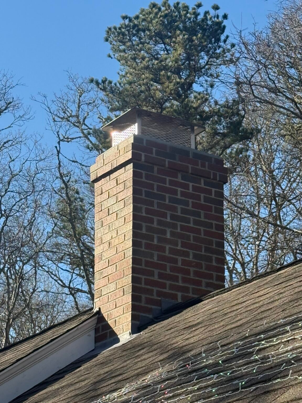 After: rebuilt chimney with new cap seen from the ground