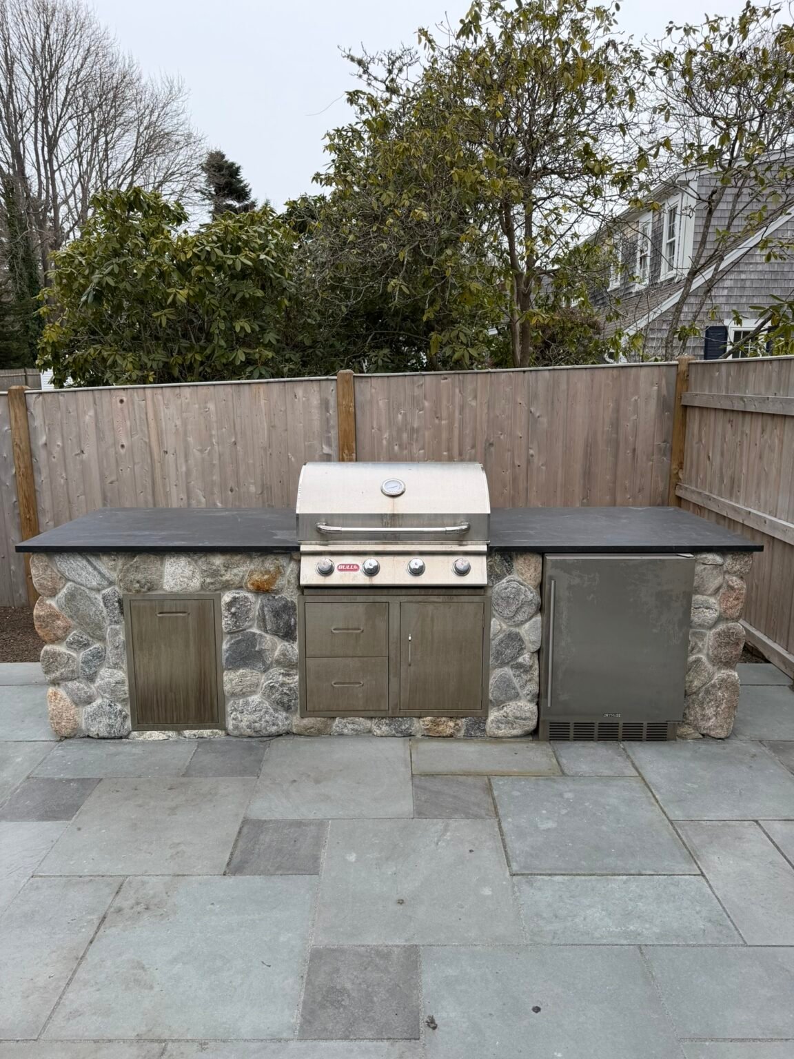 Outdoor kitchen with built in grill built by Bridi Masonry in Cape Cod, MA