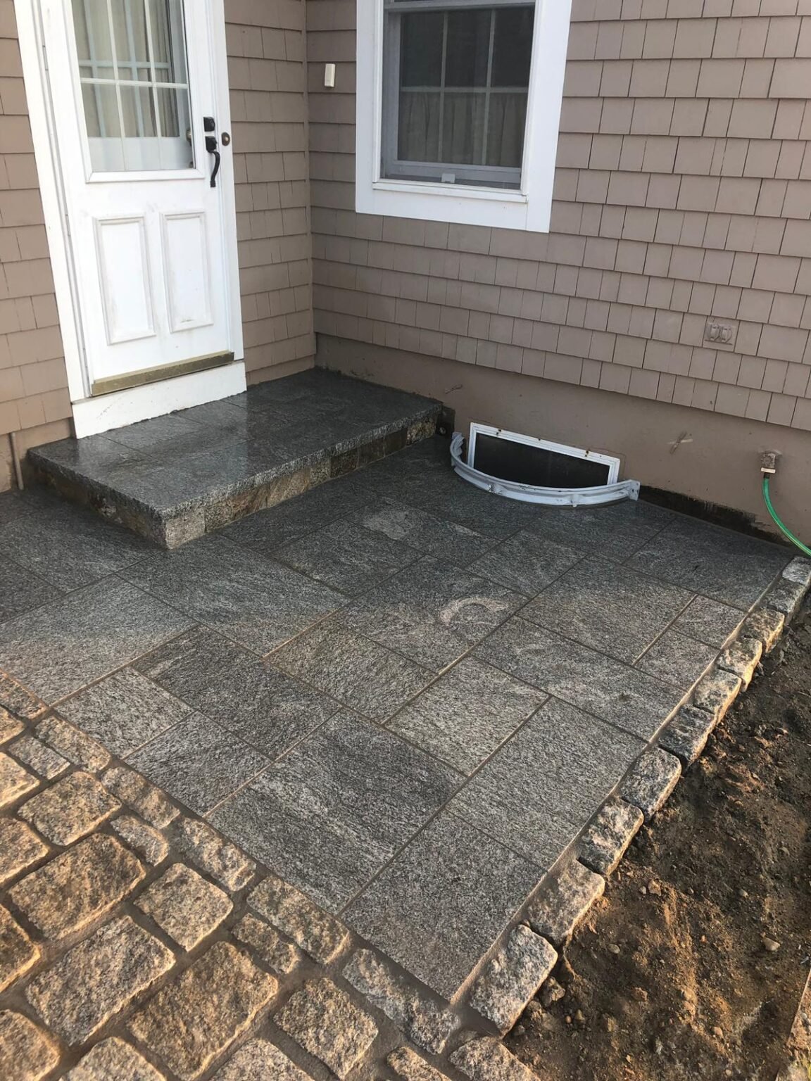 Granite patio built by Bridi Masonry in Cape Cod, MA
