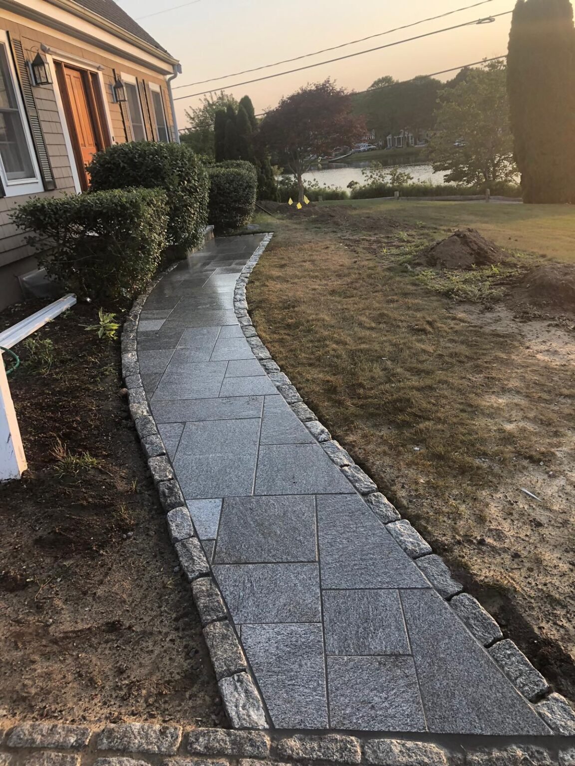 Paver walkway with cobblestone border built by Bridi Masonry in Cape Cod, MA