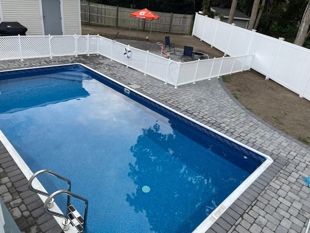 Paver pool deck built by Bridi Masonry in Cape Cod, MA