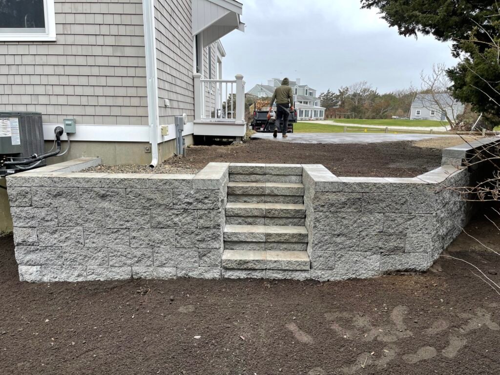 Granite retaining wall with steps built by Bridi Masonry in Cape Cod, MA