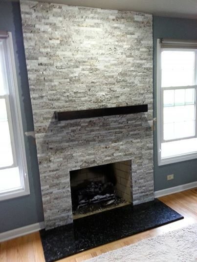 Stone veneer fireplace built by Bridi Masonry in Cape Cod, MA