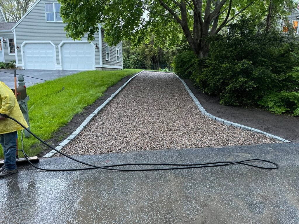 Crushed stone driveway with cobblestone border built by Bridi Masonry in Cape Cod, MA