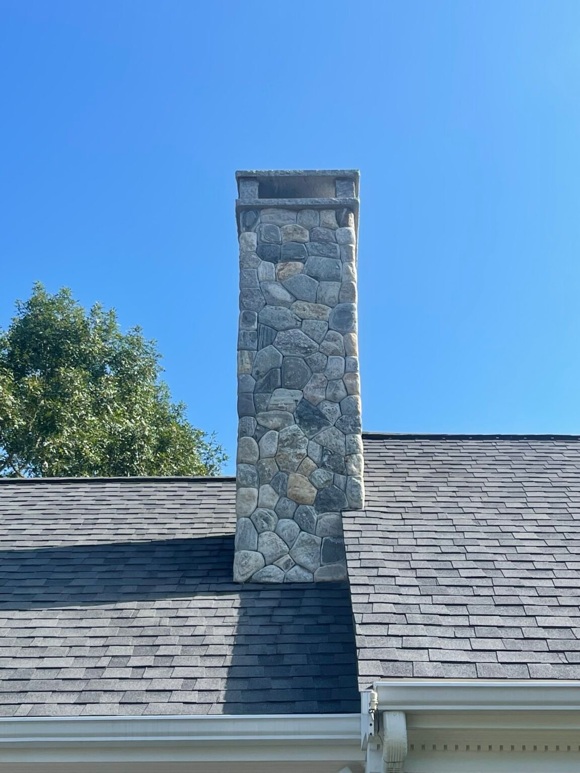 Fieldstone chimney built by Bridi Masonry in Cape Cod, MA