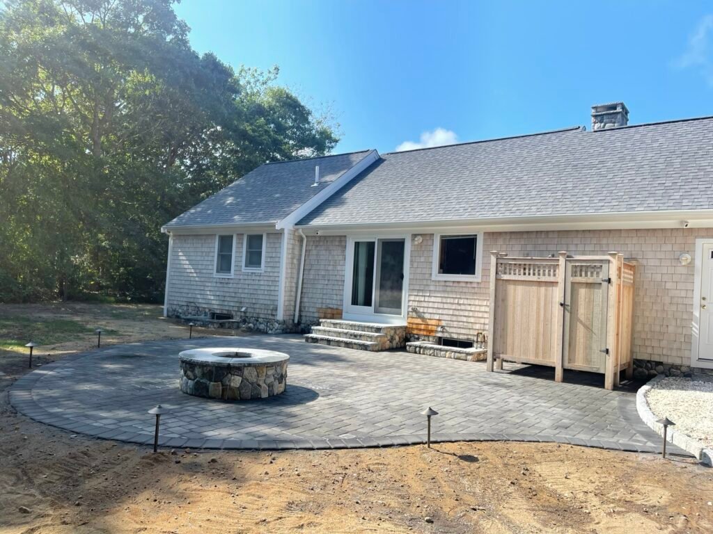 Shell patio with fire pit built by Bridi Masonry in Cape Cod, MA