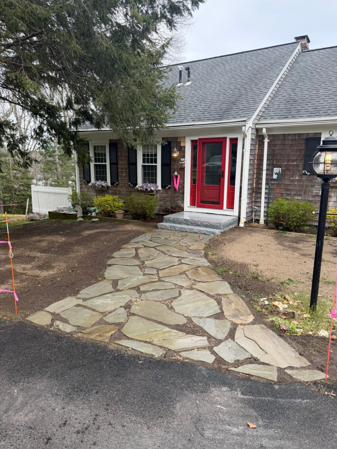 Irregular bluestone walkway built by Bridi Masonry in Cape Cod, MA