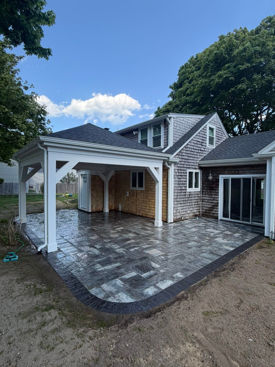 Paver patio with pavilion built by Bridi Masonry in Cape Cod, MA
