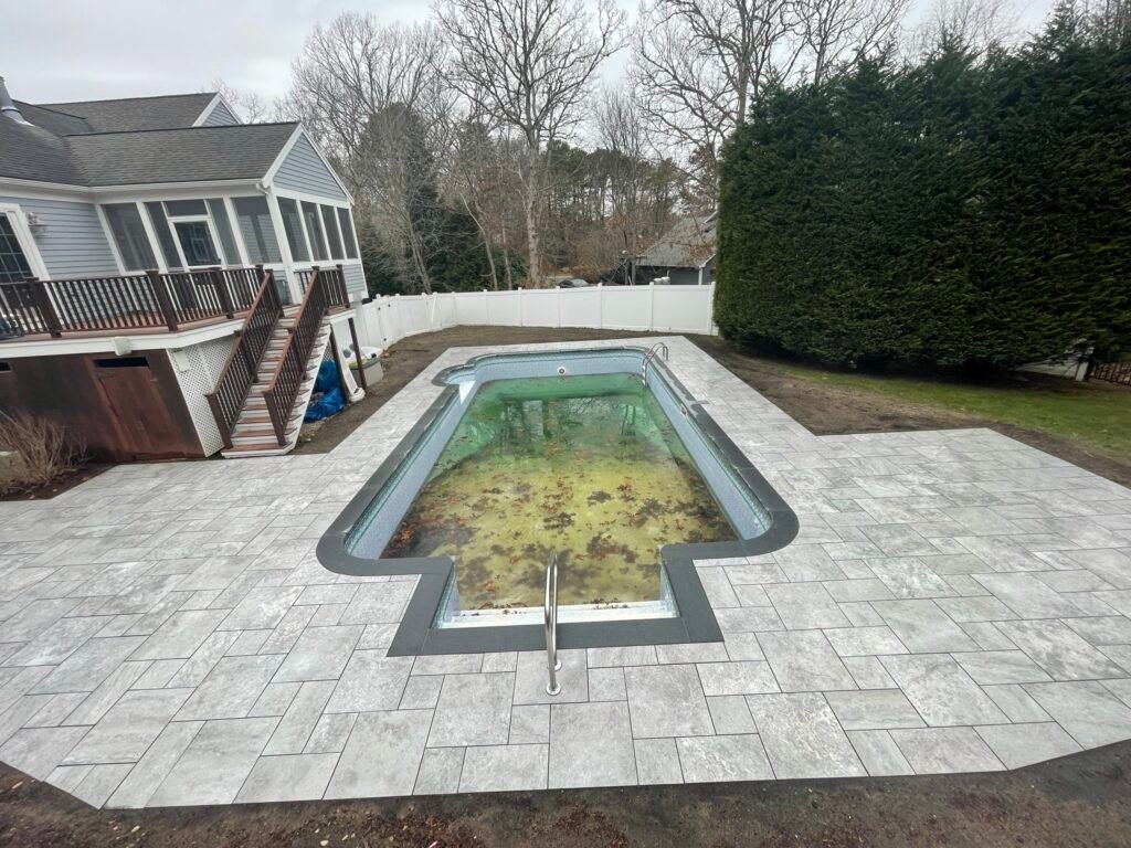 Paver pool deck built by Bridi Masonry in Cape Cod, MA