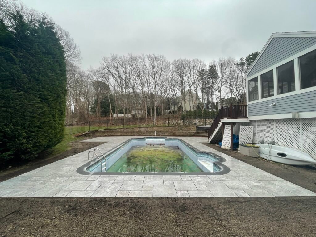 Paver pool deck built by Bridi Masonry in Cape Cod, MA