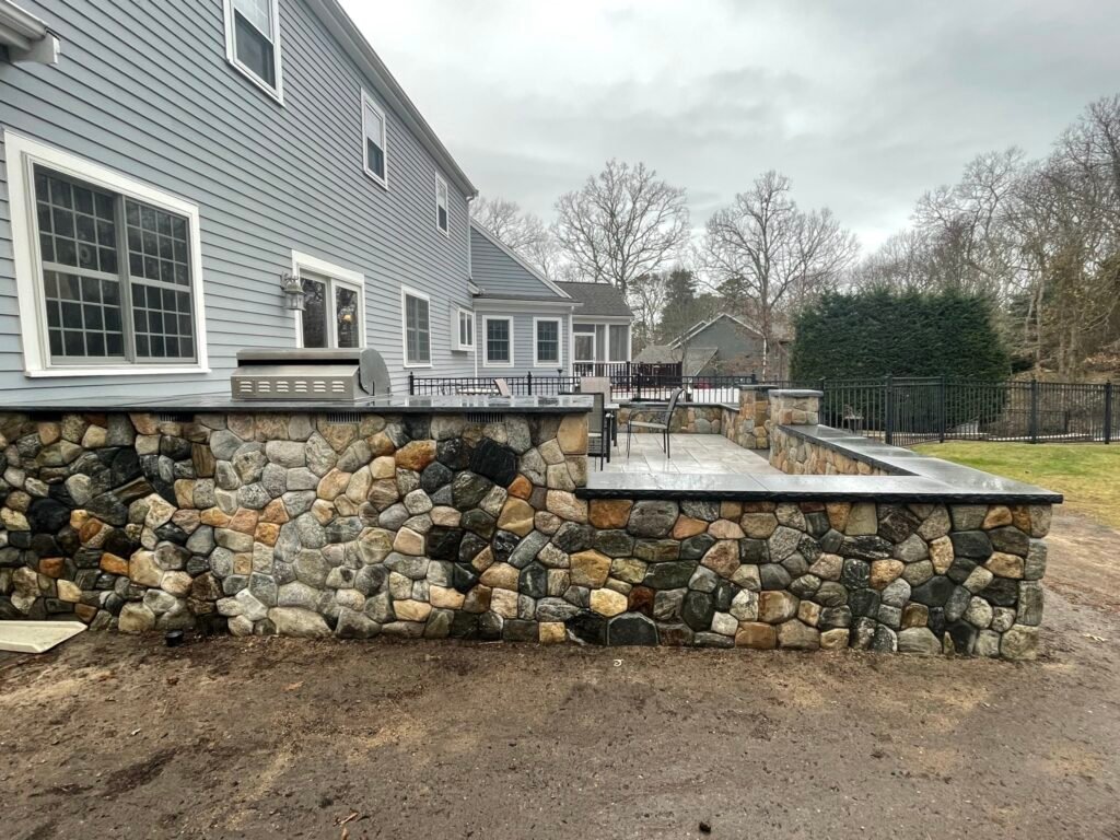 Fieldstone retaining wall built by Bridi Masonry in Cape Cod, MA