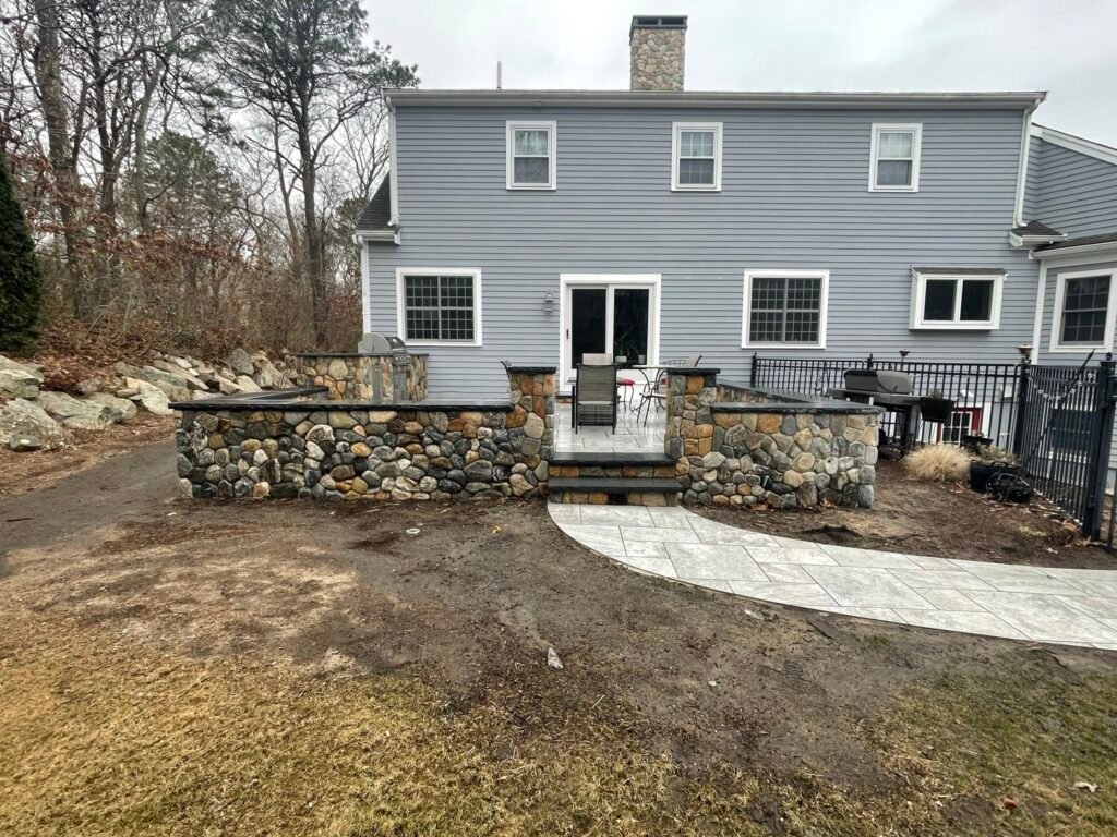Stone retaining wall and walkway built by Bridi Masonry in Cape Cod, MA