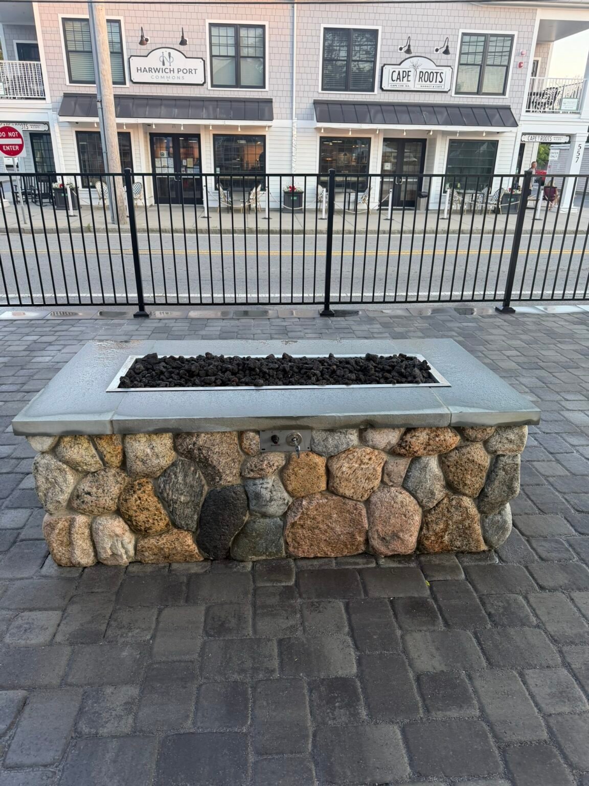 Stone fire table built by Bridi Masonry in Cape Cod, MA