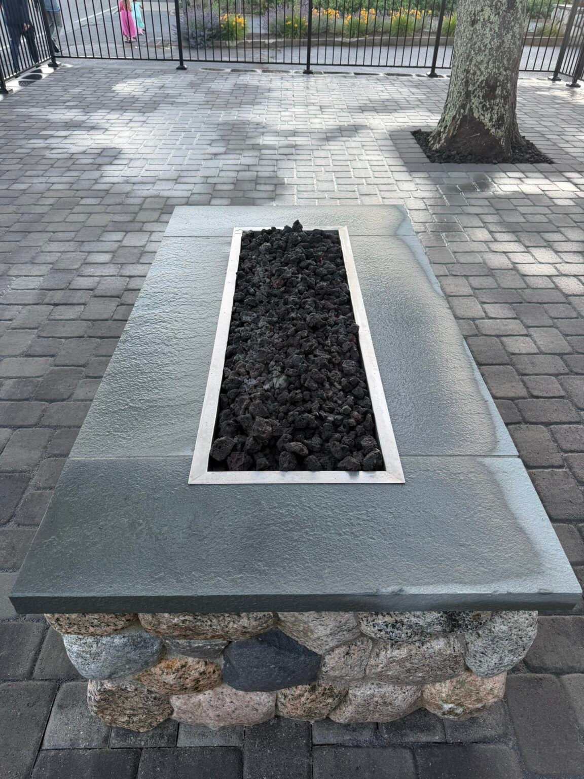 Granite fire table built by Bridi Masonry in Cape Cod, MA