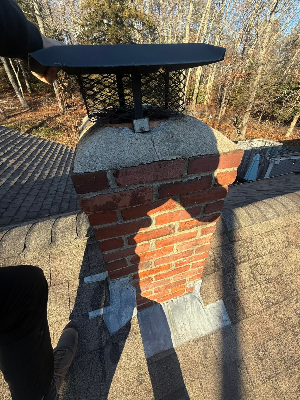 Before: crumbling chimney crown and deteriorated mortar joints on Cape Cod