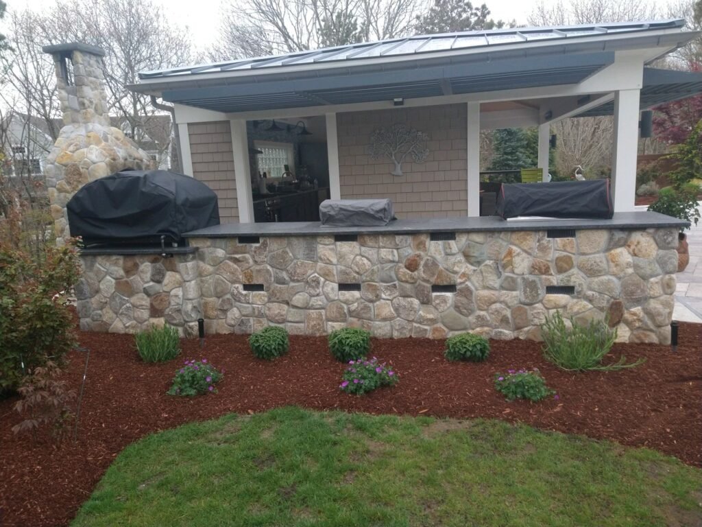 Outdoor kitchen with fieldstone veneer built by Bridi Masonry in Cape Cod, MA